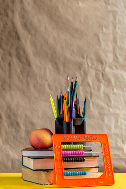 istock Back to school concept. Stack of books with school supplies 1149488667