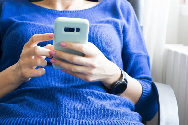 istock Young woman browsing smartphone at home or at the office 1149490682