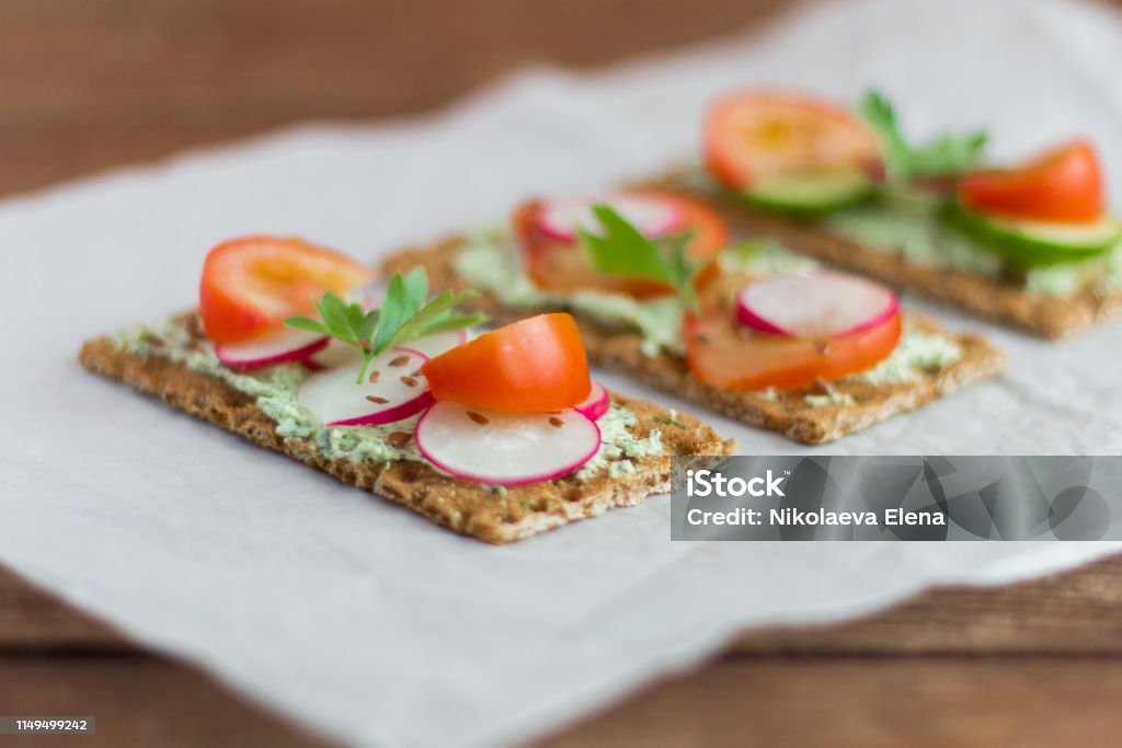 delicious diet sandwiches with cottage cheese with herbs and vegetables ,close-up,selective focus Above Stock Photo