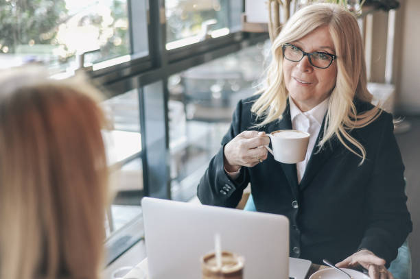 istock Two senior women, colleagues working together on coffee break 1149500844