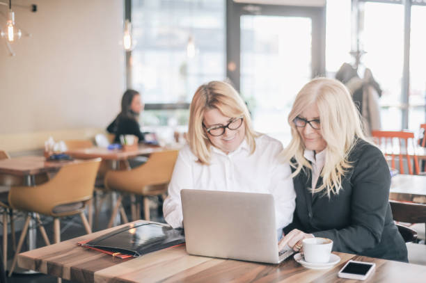 istock Two senior women, colleagues working together on coffee break 1149501074