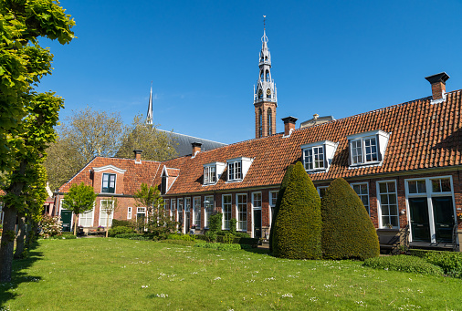 The Sint Anthony Gasthuis with old almshouses around a small, public courtyard  in the Dutch city of Groningen. Netherlands