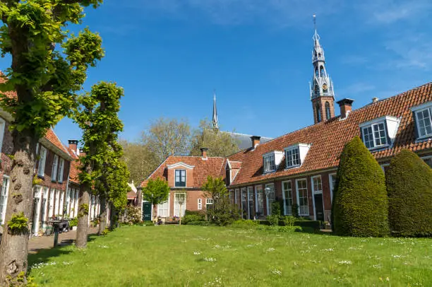 Old almshouses around a small, public courtyard (Sint Anthony Gasthuis) in the Dutch city of Groningen. Netherlands