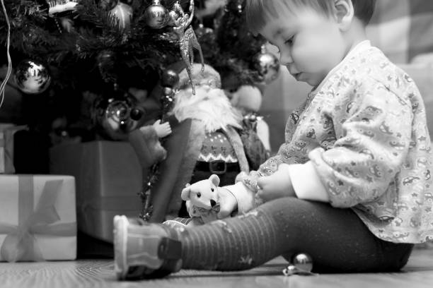istock Little children near a Christmas 1149508400