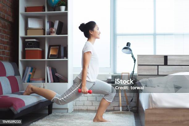 Asian Women Exercising In Bed In The Morning She Feels Refreshedshe Acts As Squash Stock Photo - Download Image Now