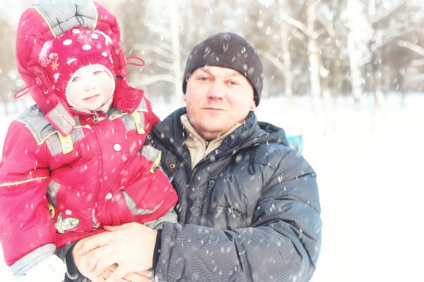 istock Young family in winter park 1149509488