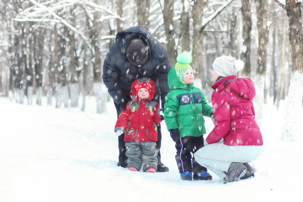 istock Young family in winter park 1149514959