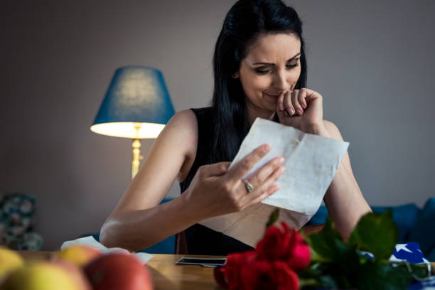 Portrait of a sad woman at home. Memorial day concept.