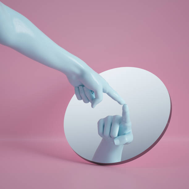 istock 3d render, hand reflection in round mirror isolated on pink background, abstract conceptual composition, pointing finger, show gesture, mannequin body part 1149518399