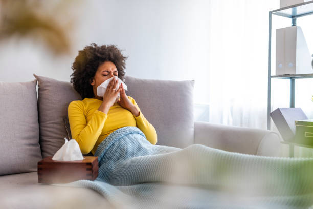 istock Sick African American woman lying on the sofa 1149521557