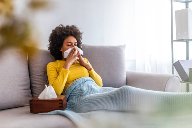 istock Sick African American woman lying on the sofa 1149522182
