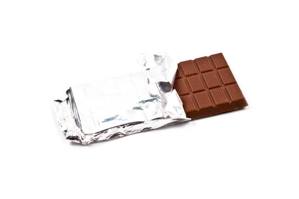 istock Milk chocolate bar in foil isolated on white. 1149522678