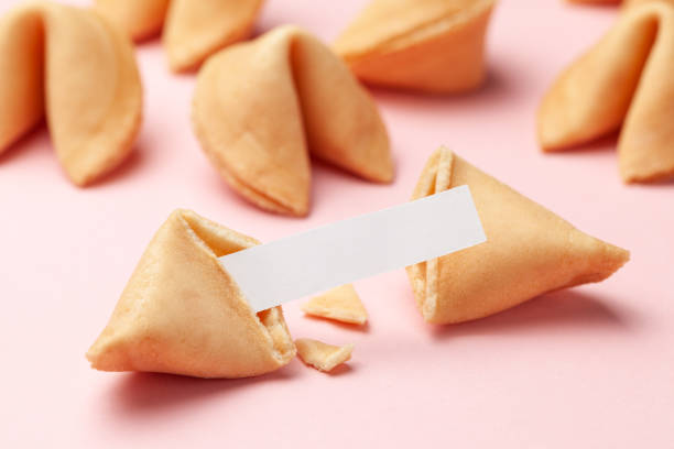 istock Chinese fortune cookies. Cookies with empty blank inside for prediction words. Pink background. 1149526011