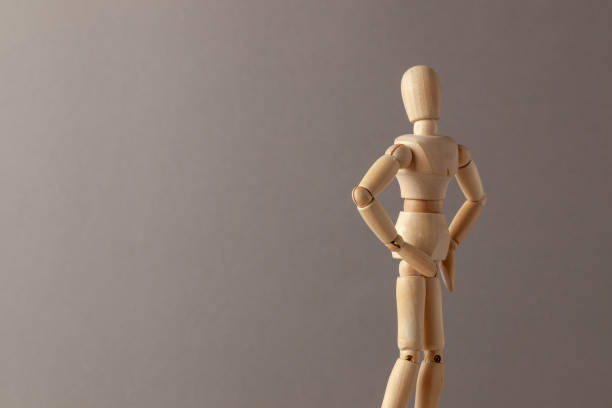 istock The man turned his back, displeased, on a gray background. Copy space for text. 1149526340