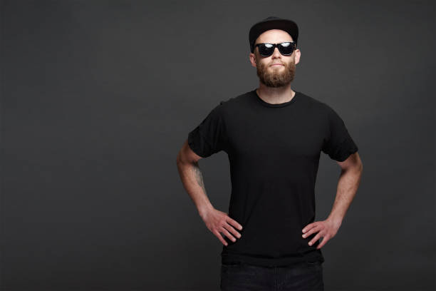 istock Hipster handsome male model with beard wearing black blank baseball cap with space for your logo 1149534306