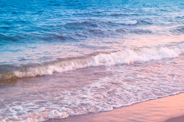 istock Close up  wave washing up the beach on sunset. Summer background. Copy space 1149540297