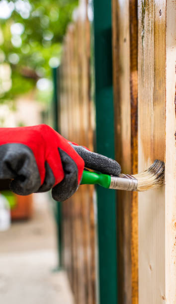 istock Paintin wooden surface with a brush 1149544628