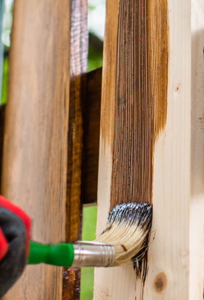 istock Paintin wooden surface with a brush 1149544630