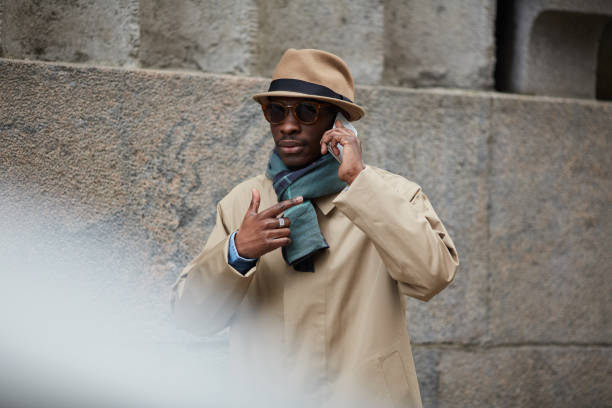 istock Modern African Man Speaking by Phone in City 1149545181