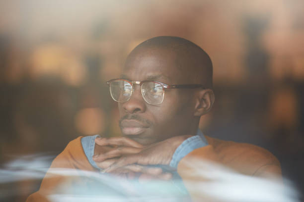 istock African Man Looking at Window in Cafe 1149545205