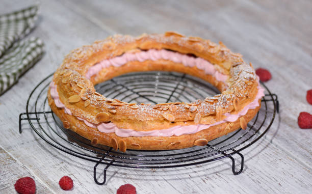 Homemade choux pastry cake Paris Brest with raspberries Homemade choux pastry cake Paris Brest with raspberries. brest brittany photos stock pictures, royalty-free photos & images