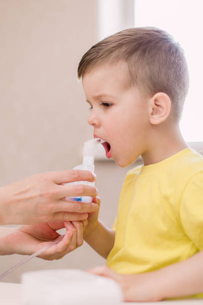 istock mother treats bronchitis in a child with a nebulizer 1149548917