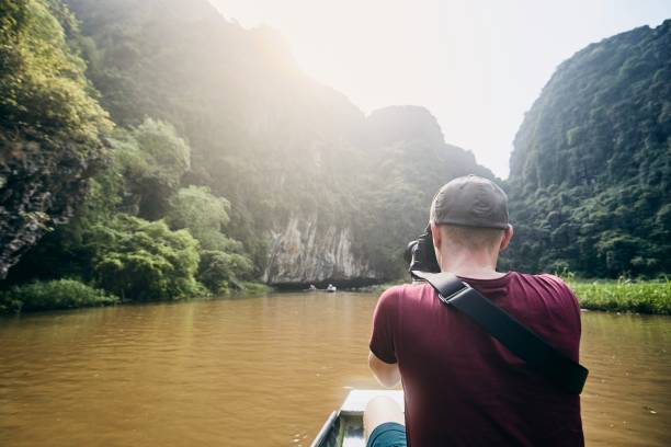 istock Photographer with camera on boat 1149552445