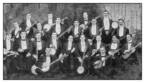 Antique photo: Cambridge University Banjo and Mandolin Orchestra Antique photo: Cambridge University Banjo and Mandolin Orchestra performance group photos stock illustrations