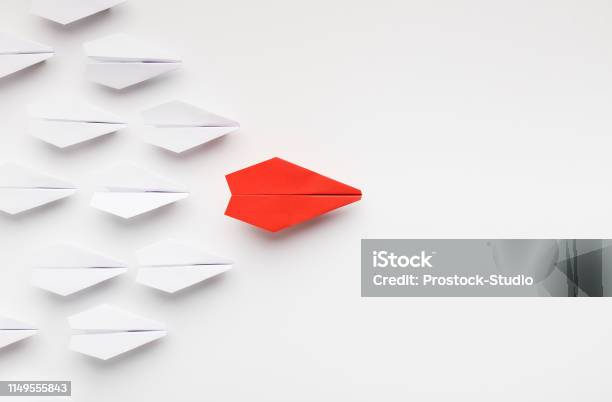 Red Paper Plane Leading Another Ones Leadership Concept Stock Photo - Download Image Now