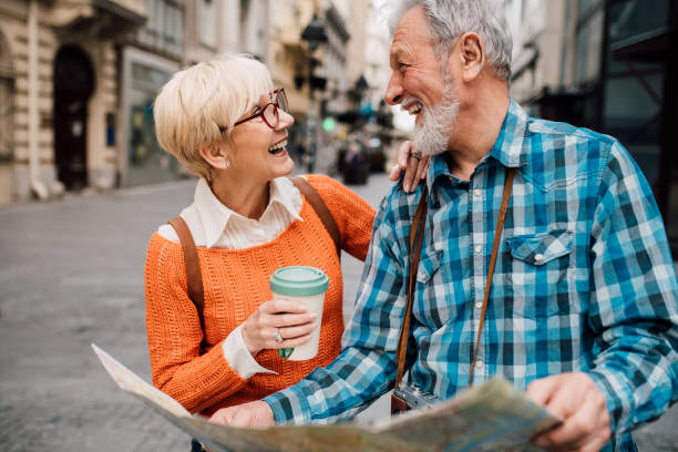 istock Mature couple holding touristic map 1149556584