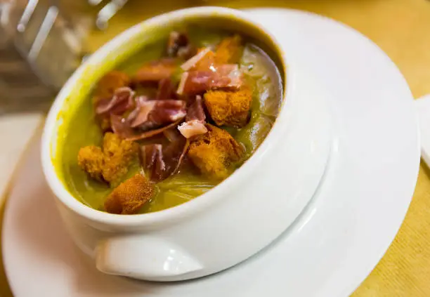 Photo of Zucchini cream soup with croutons and ham