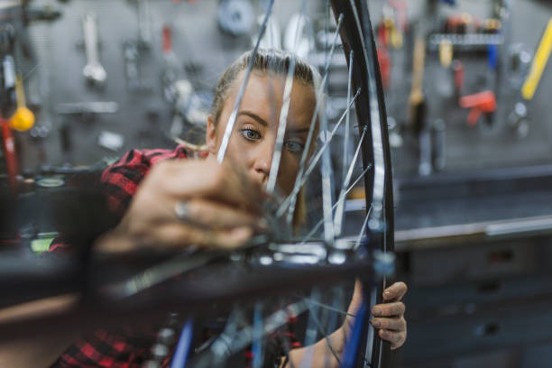 istock Bicycle mechanic in a workshop in the repair process. 1149559043