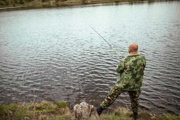 istock Fisherman with a fishing rod 1149560577