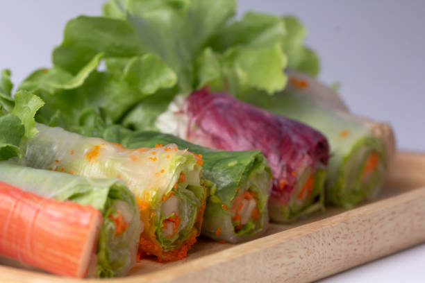 istock Asian Spring roll with mix vegetables on wooden plate. 1149560691