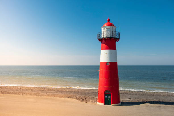 Traditional red white steel lighthouse in Westkapelle, Netherlands.