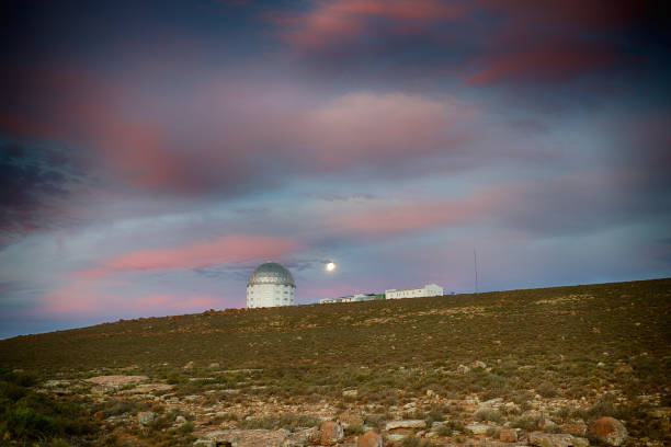 istock Observatory Astronomy Telescope with full moon at sunset 1149563408