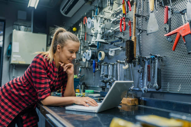 istock Bike shop owner doing quality control on laptop 1149563867