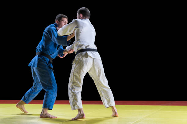 istock Judo players competing during match 1149564063