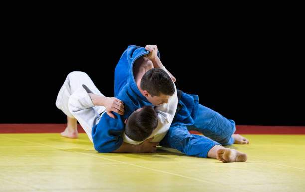 istock Judo players competing during match 1149564066