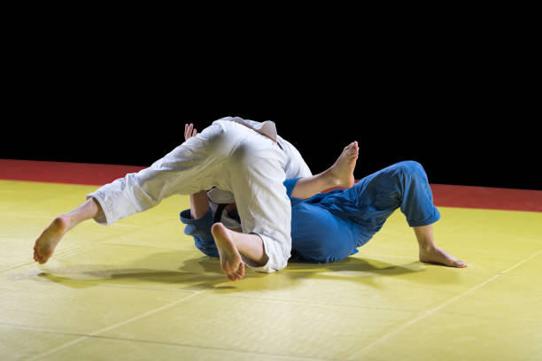 istock Judo players competing during match 1149564071