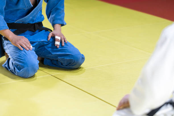 istock Judo players kneeling on mat 1149564084
