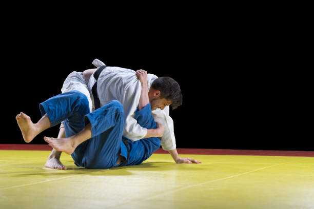 istock Judo players competing during match 1149564087
