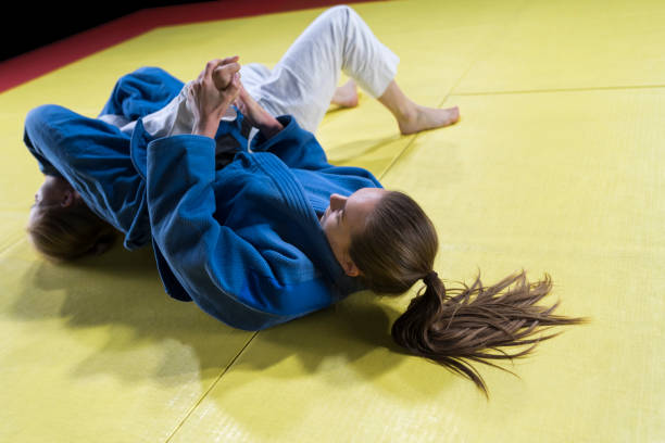 istock Judo players competing during match 1149564088