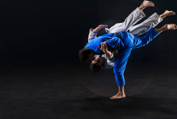 istock Judo players competing during match 1149564128
