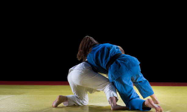 istock Judo players competing during match 1149564169