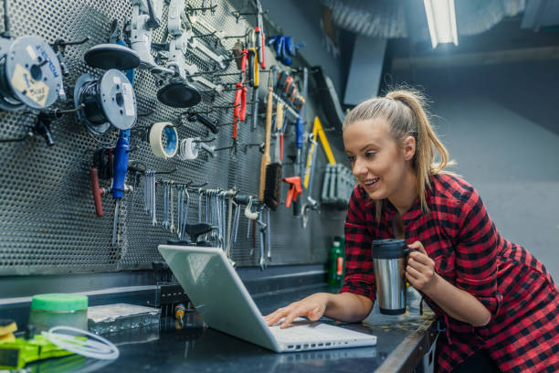 istock Young female mechanic with laptop. 1149564283