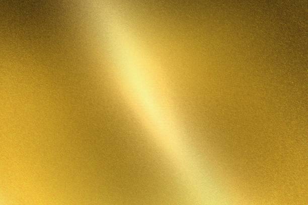 istock Light shining on gold metal sheet, abstract texture background 1149565362