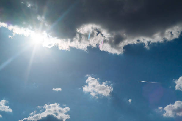 istock The sun shines bright in summer. Blue sky and clouds. 1149566211