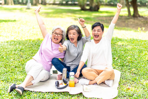 istock Three elderly Asian women partying in the park 1149567873