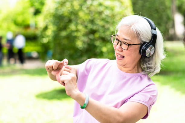 istock An elderly Asian woman is playing in the park 1149568257